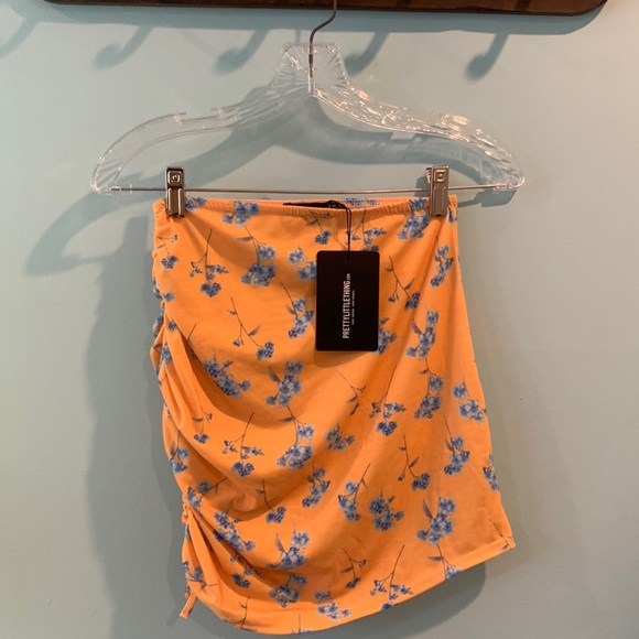 NWT Mustard Printed Jersey Ruched Tie Side Mini Skirt - Picture 2 of 6